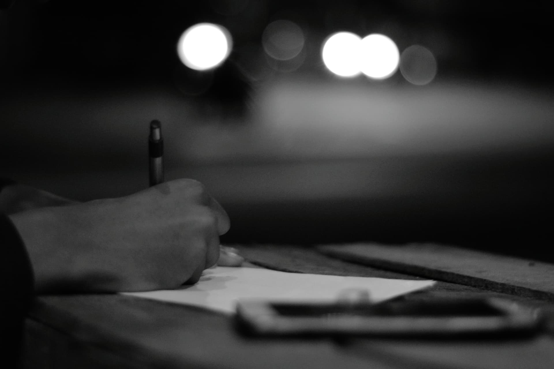 cropped hand writing on paper